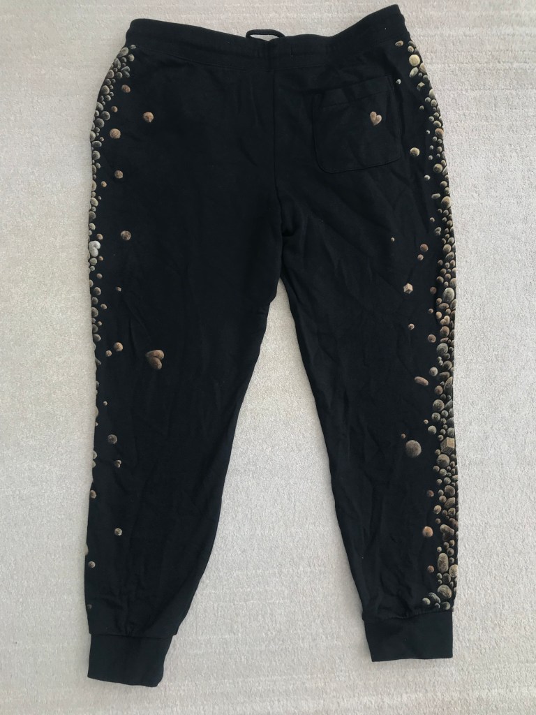 back of cotton joggers painted with bleach